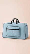 Quilted travel storage bag, Signature Ease collection. Front view, elegant and organized luggage solution.